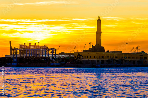 The lighthouse  of Genoa (called Lanterna) at sunset, Italy photo