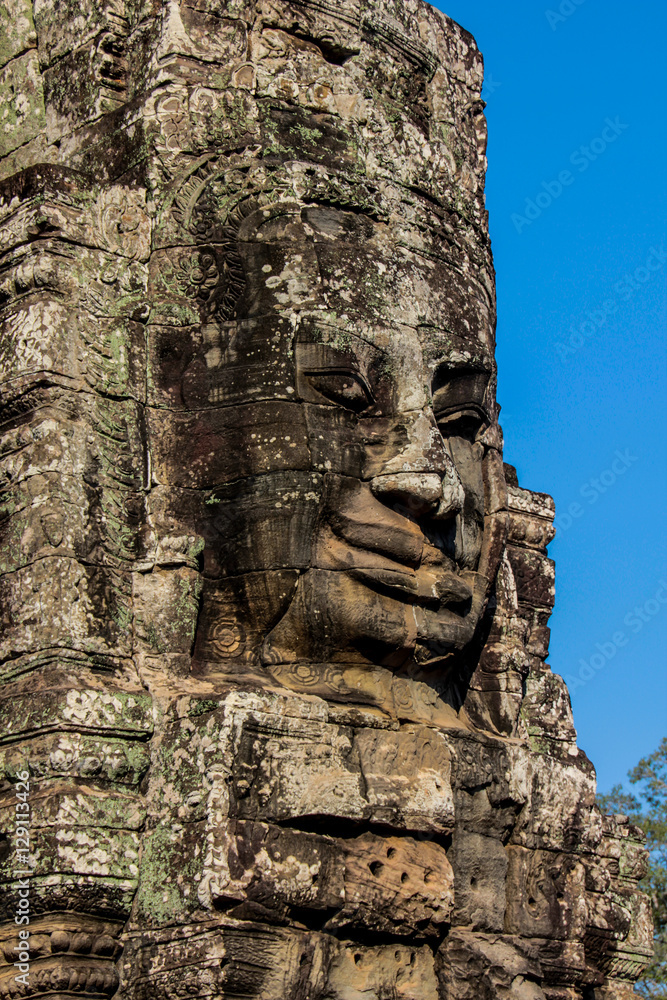 Faces statue, landmark in Angkor Wat in Cambodia