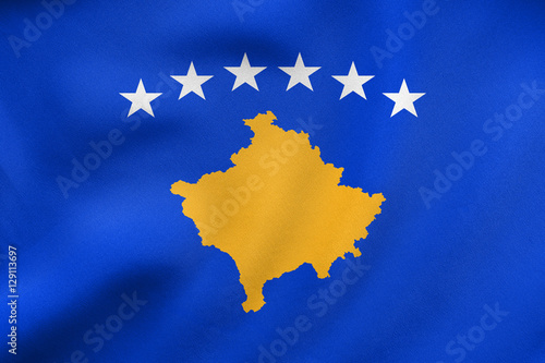 Flag of Kosovo waving, real fabric texture