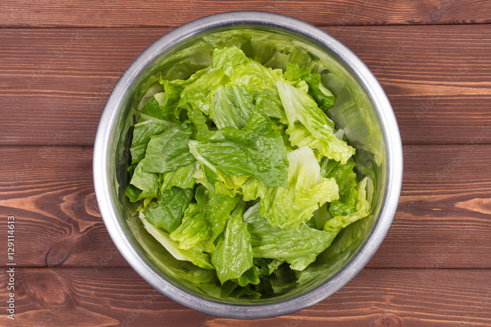 Wooden spoon and ingredients on dark background. Vegetarian food, health or cooking concept