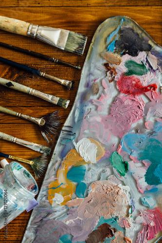 Palette of oil paints and brushes