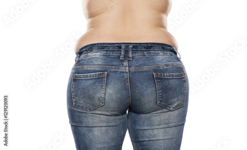 rear view of a fat woman in jeans on white background