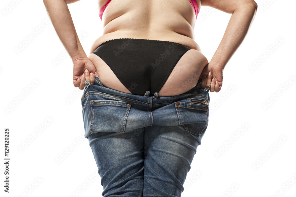 fat woman putting on tight jeans on a white background Stock Photo | Adobe  Stock