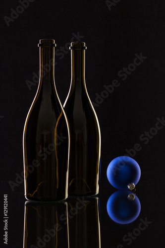 Silhouette of elegant wine bottles and Christmas decoration