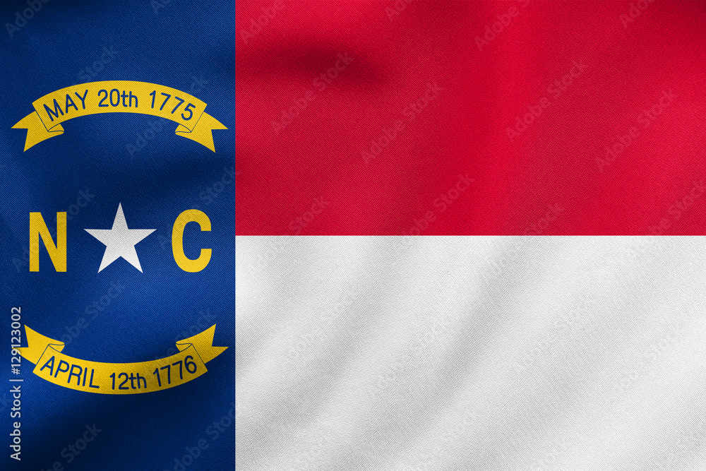 Fototapeta premium Flag of North Carolina waving, real fabric texture