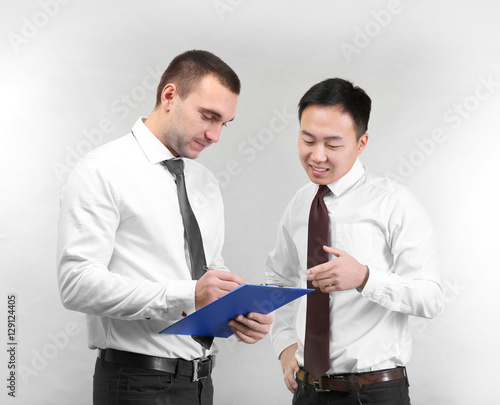 Handsome men discussing iss...