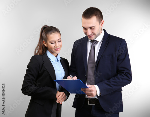 Young man and woman discuss...