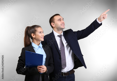 Young man and woman discuss...