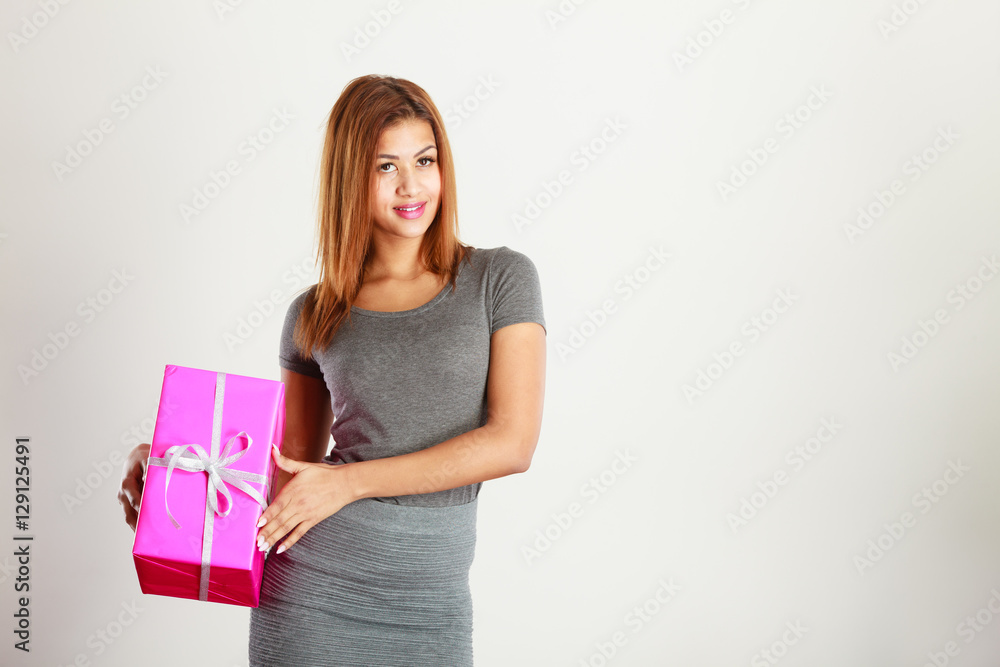Beautiful woman with pink gift. Beautiful woman with pink gift.