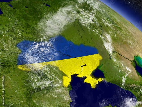 Fototapeta Ukraine with embedded flag on Earth
