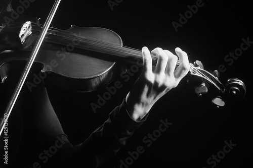 Violin player violinist hands playing musical instruments photo