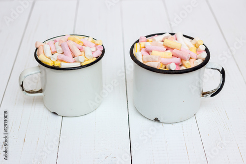 Two cups of hot cocoa with color marshmallow
