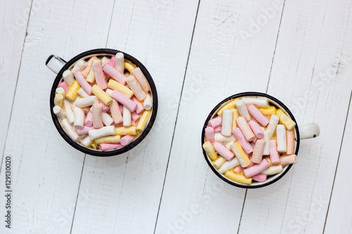 Two cups of hot cocoa with color marshmallow