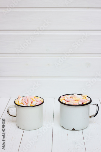 Two cups of hot cocoa with color marshmallow