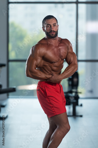 Handsome Body Builder Making Side Chest Pose