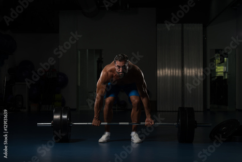 Back Exercise With Barbell In Fitness Center