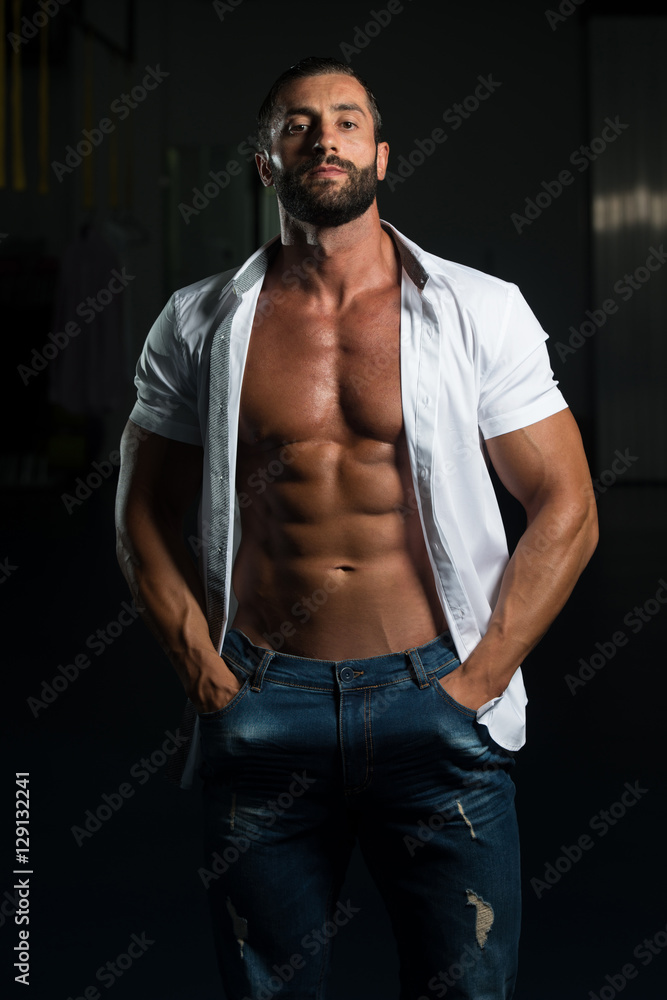 Sexy Italian Man Posing In White Shirt Stock Photo | Adobe Stock