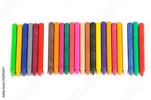 color crayons in a row isolated on white background