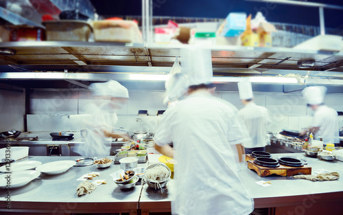 motion chefs of a restaurant kitchen