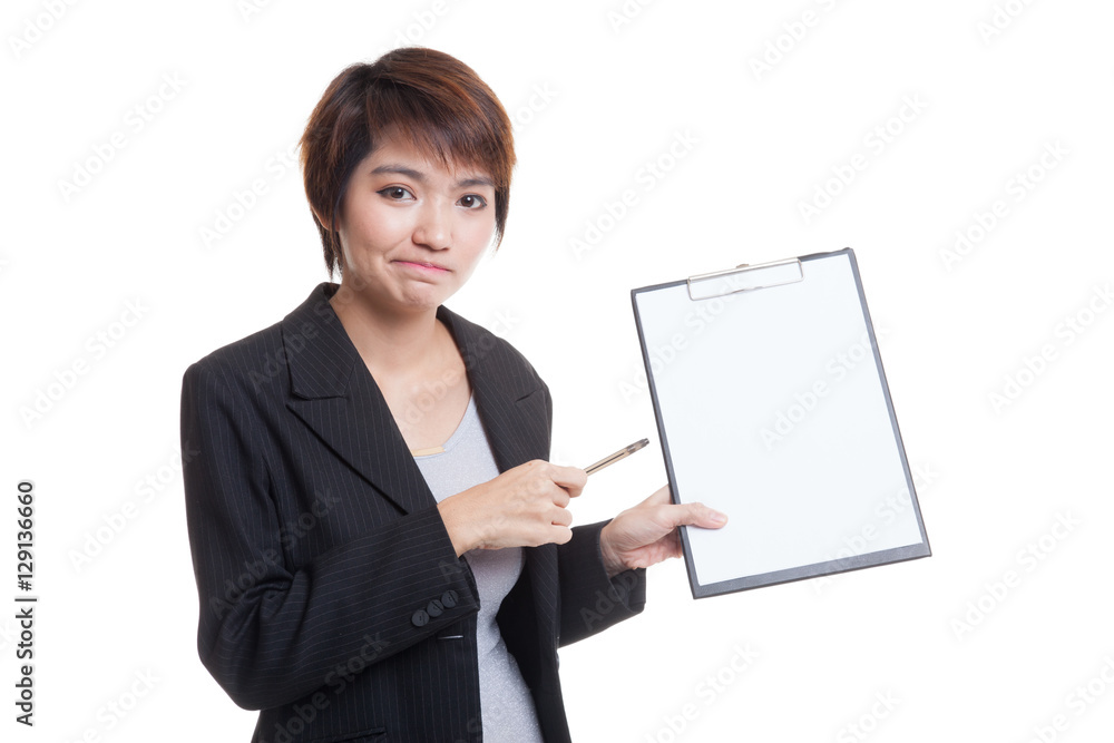 Unhappy Asian business woman point to clipboard with pen. Unhappy Asian business woman point to clipboard with pen.