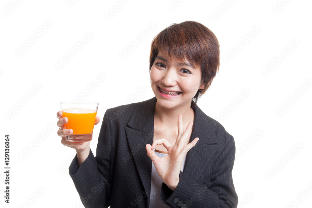 Young Asian woman show OK drink orange juice. Young Asian woman show OK drink orange juice.