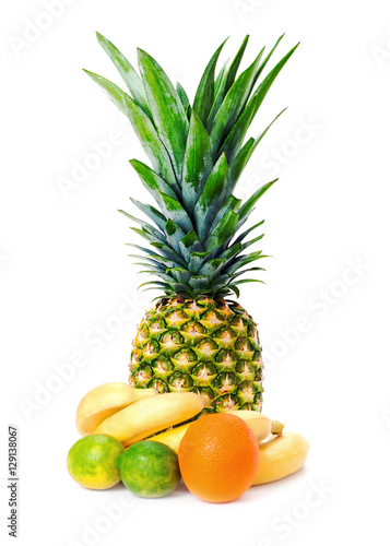 Ripe whole pineapple with ananas  bananas  limes and orange isolated on white background. Closeup.