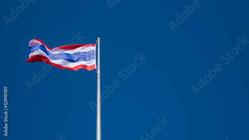 thai flag with blue sky background.