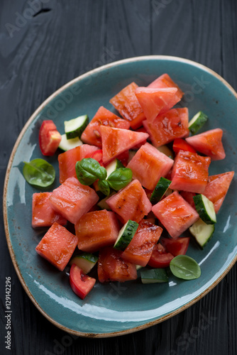 Grilled watermelon, tomato and cucumber salad, close-up