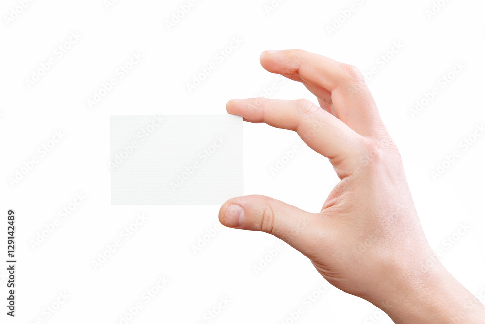 Obraz premium Male hand holding white business card at isolated background