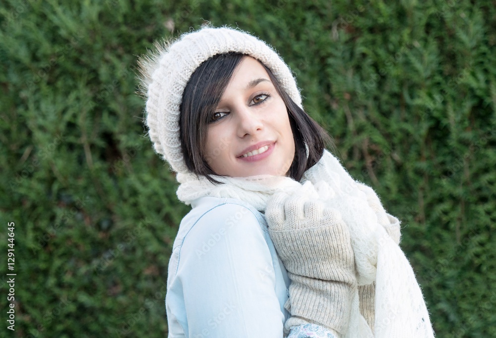 portrait of pretty young brunette with winter hat, outdoor portrait of pretty young brunette with winter hat, outdoor