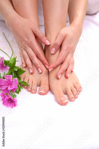 Fototapeta Naklejka Na Ścianę i Meble -  Closeup photo of a beautiful female feet with pedicure