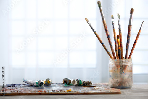 Paint brushes with a palette.