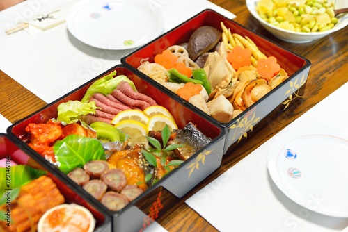 Osechi, traditional Japanese New Year food, in black lacqueware boxes
