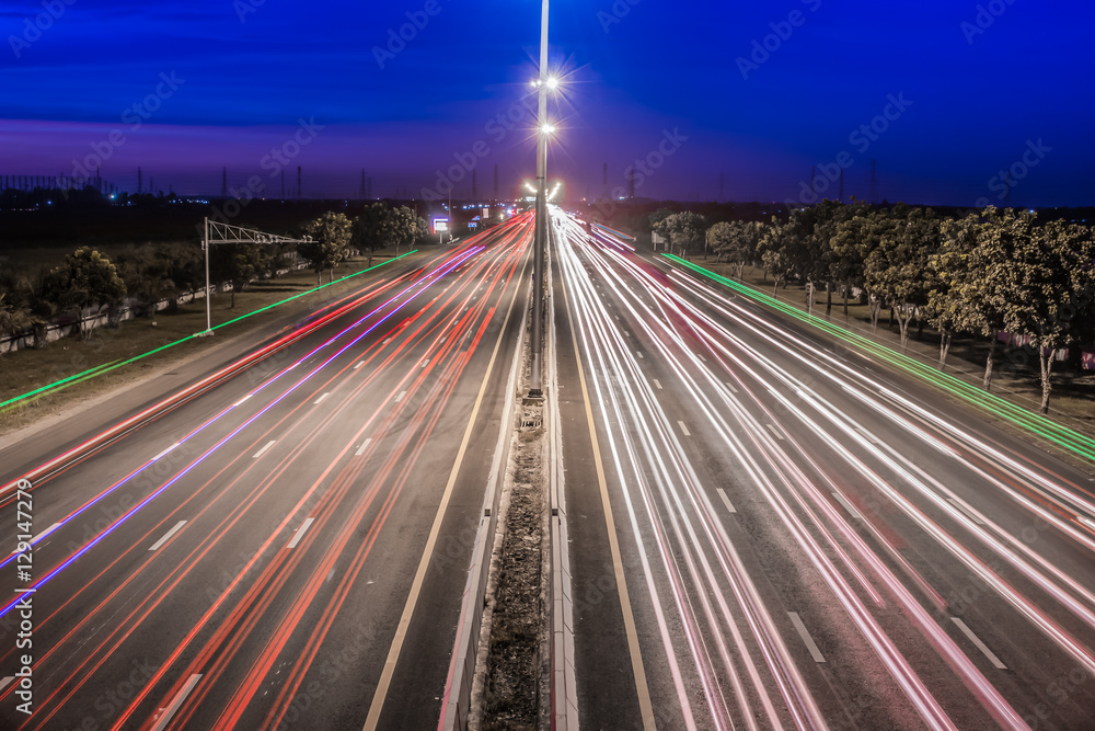Speed Traffic at light trails on motorway highway at night,backg