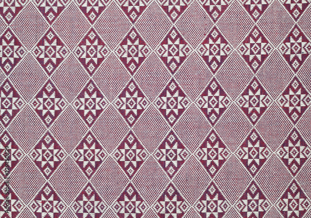 Red cotton fabric in Thai pattern for background or texture Red cotton fabric in Thai pattern for background or texture