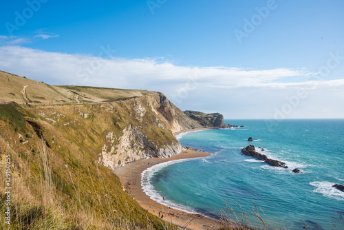 Beautiful cliff and beach with blue sky in sunshine day © gamelover