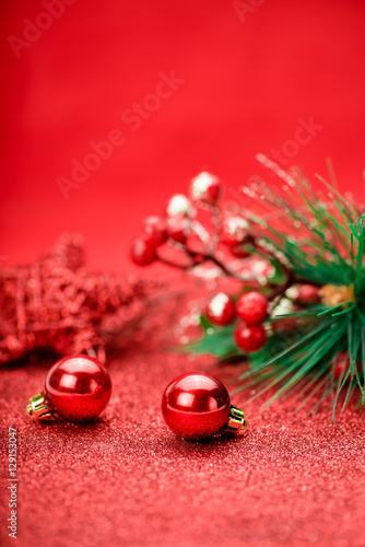 Christmas holiday concept. Red balls with star and branch tree on background. Bokeh. © Tatyana Sidyukova