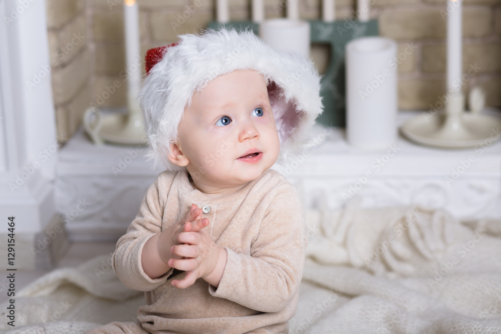 photo of cute baby in Santa hat photo of cute baby in Santa hat