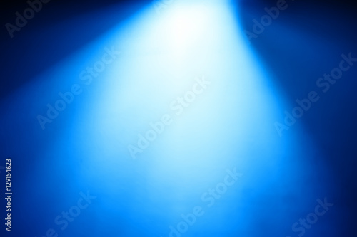Diagonal blue light from top bokeh background