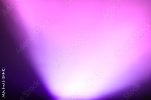 Diagonal purple pink light from bottom bokeh background