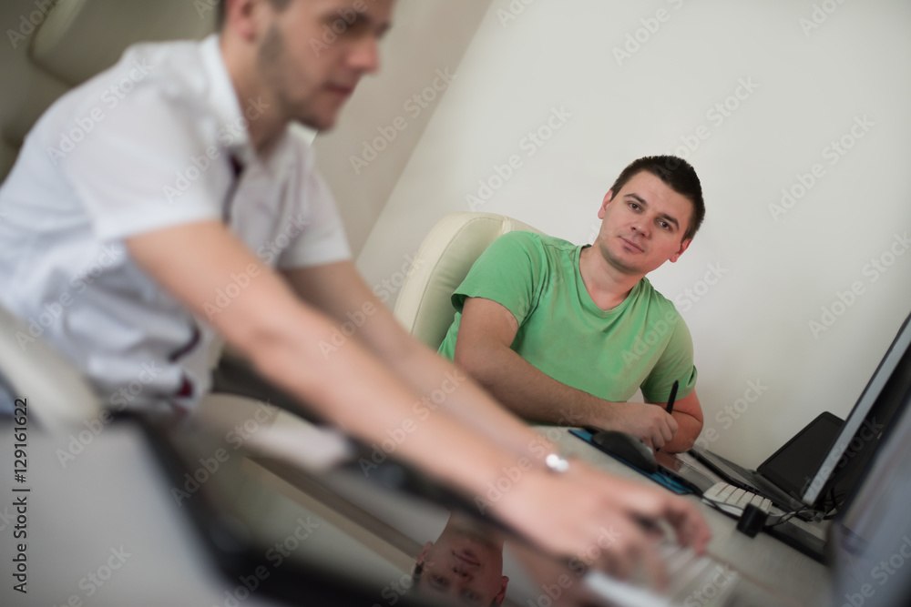 a group of graphic designers at work a group of graphic designers at work