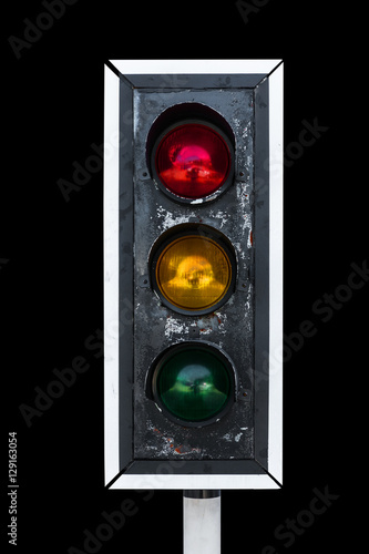 Old traffic light, isolated on black background