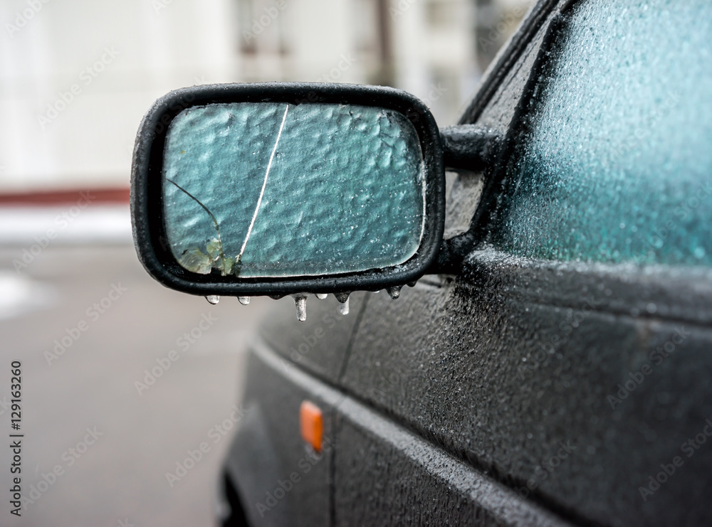 Car covered with ice after freezing rain