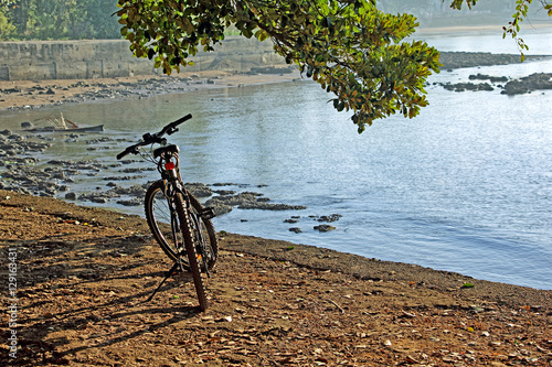 Bicycle parked at the elevated pathway while cycling along the coastline at Bambolim in Goa  India