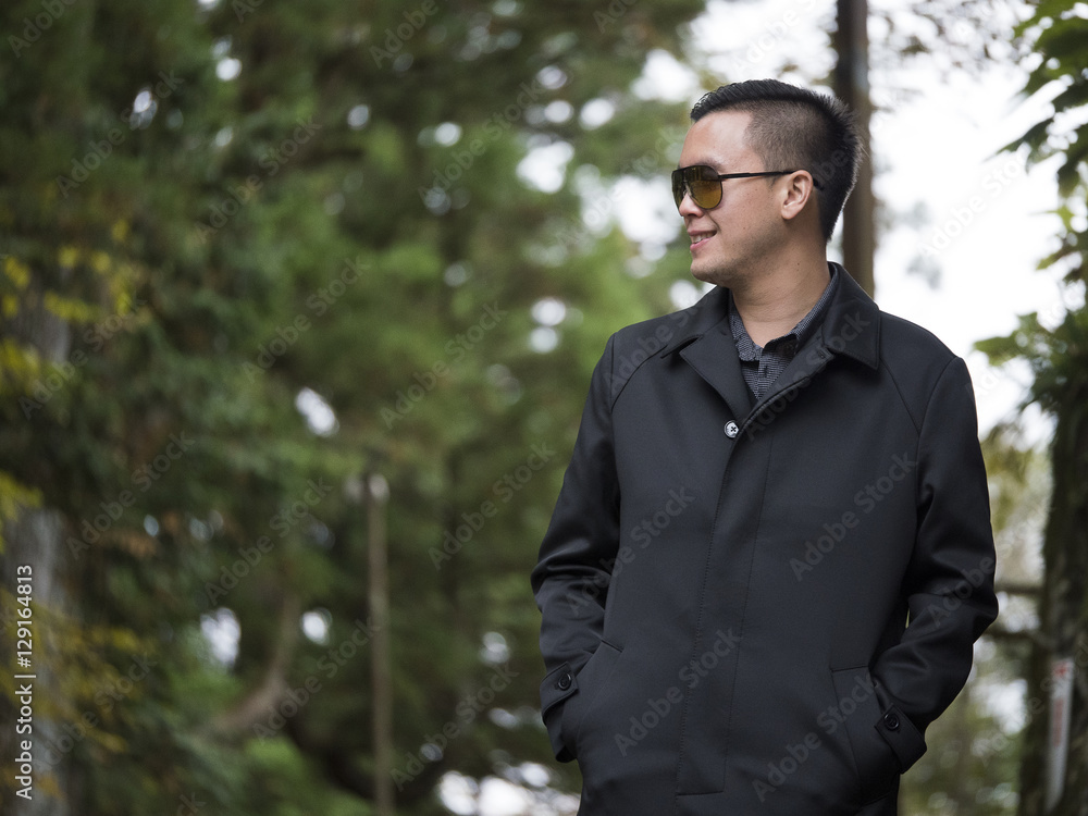 a man relaxing with a beautiful Japan , Nikko autumn tree . focus on the model . Japan autumn set a man relaxing with a beautiful Japan , Nikko autumn tree . focus on the model . Japan autumn set