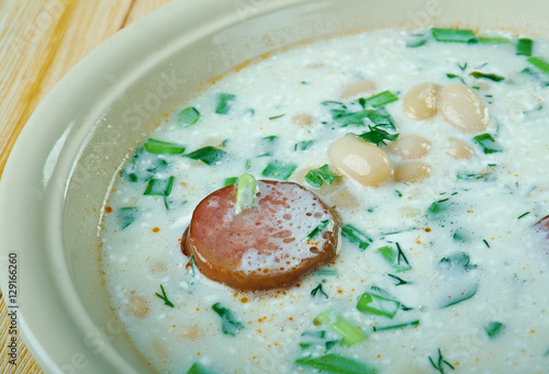 Soup with beans, sour cream and sausage photo