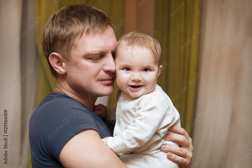 Young father kisses with his baby daughter
Young father kisses with his baby daughter