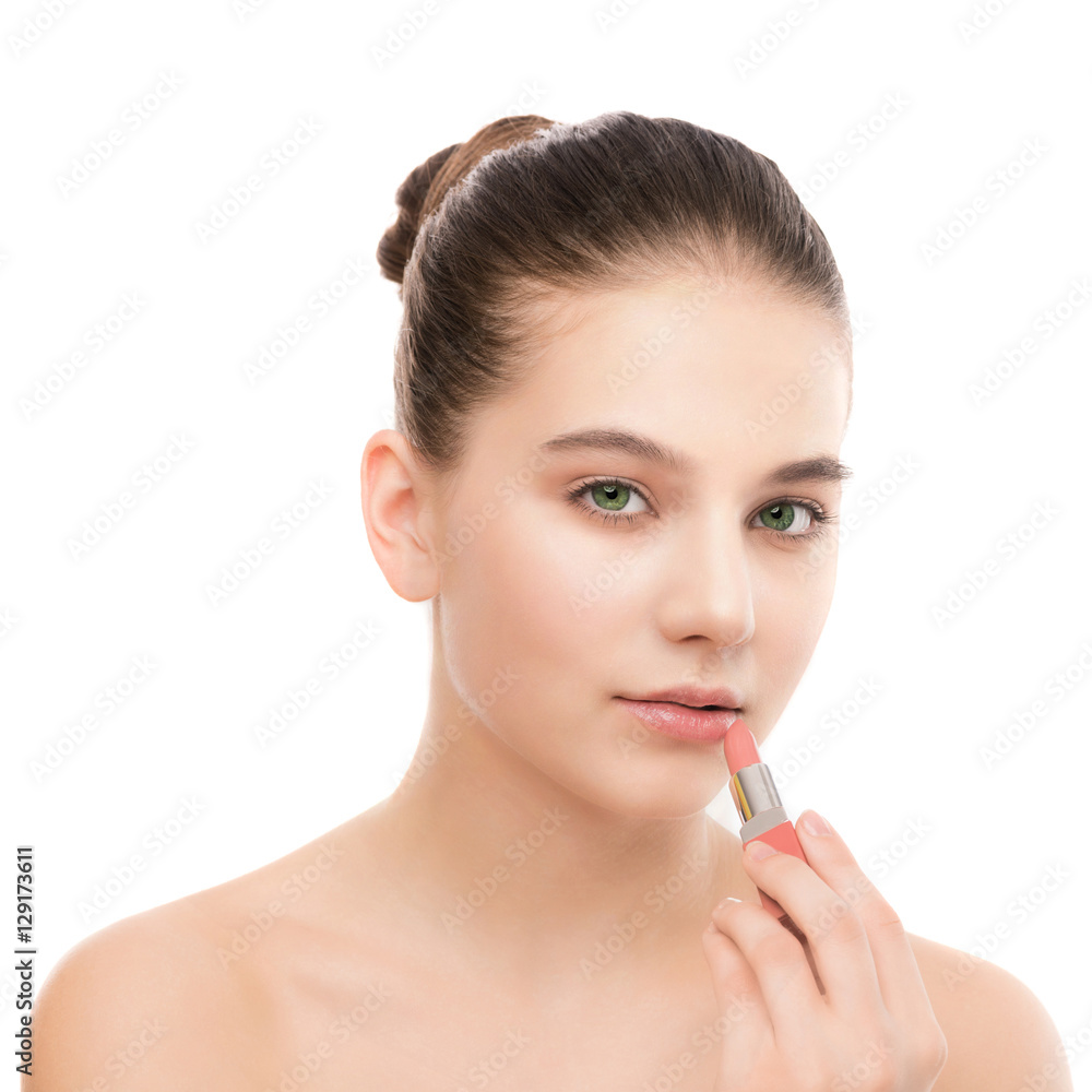 Portrait of beautiful young brunette woman with clean face. Beauty spa model girl with perfect fresh clean skin applying lipstick. Youth and skin care concept. Isolated on a white background. Portrait of beautiful young brunette woman with clean face. Beauty spa model girl with perfect fresh clean skin applying lipstick. Youth and skin care concept. Isolated on a white background.