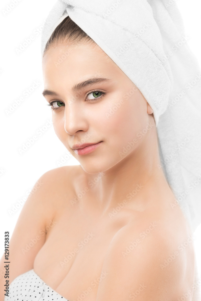 Beautiful young brunette woman with clean face and towel on her head. Beauty spa model girl perfect fresh clean skin. Youth and skin care concept. Isolated. Beautiful young brunette woman with clean face and towel on her head. Beauty spa model girl perfect fresh clean skin. Youth and skin care concept. Isolated.