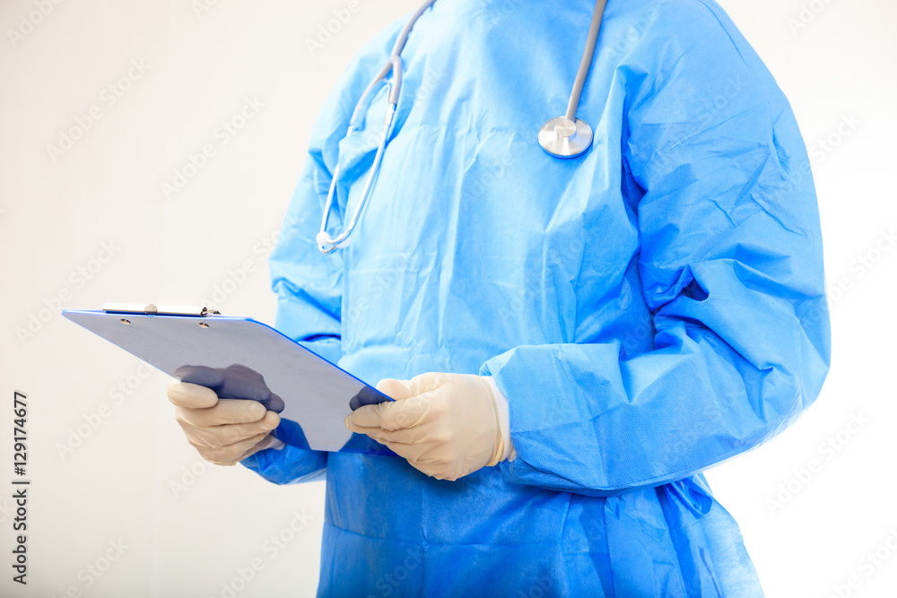 Surgeon holding a clipboard Surgeon holding a clipboard